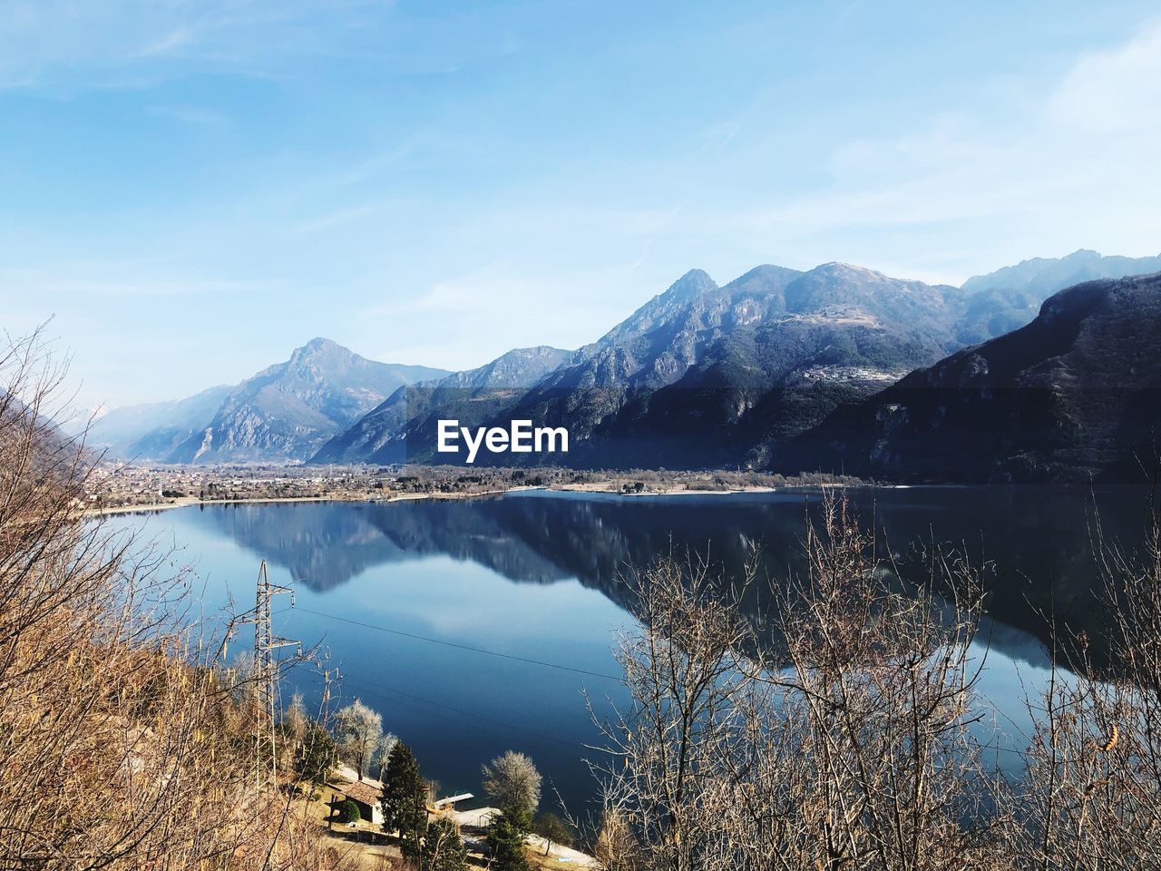 Scenic view of lake and mountains against sky