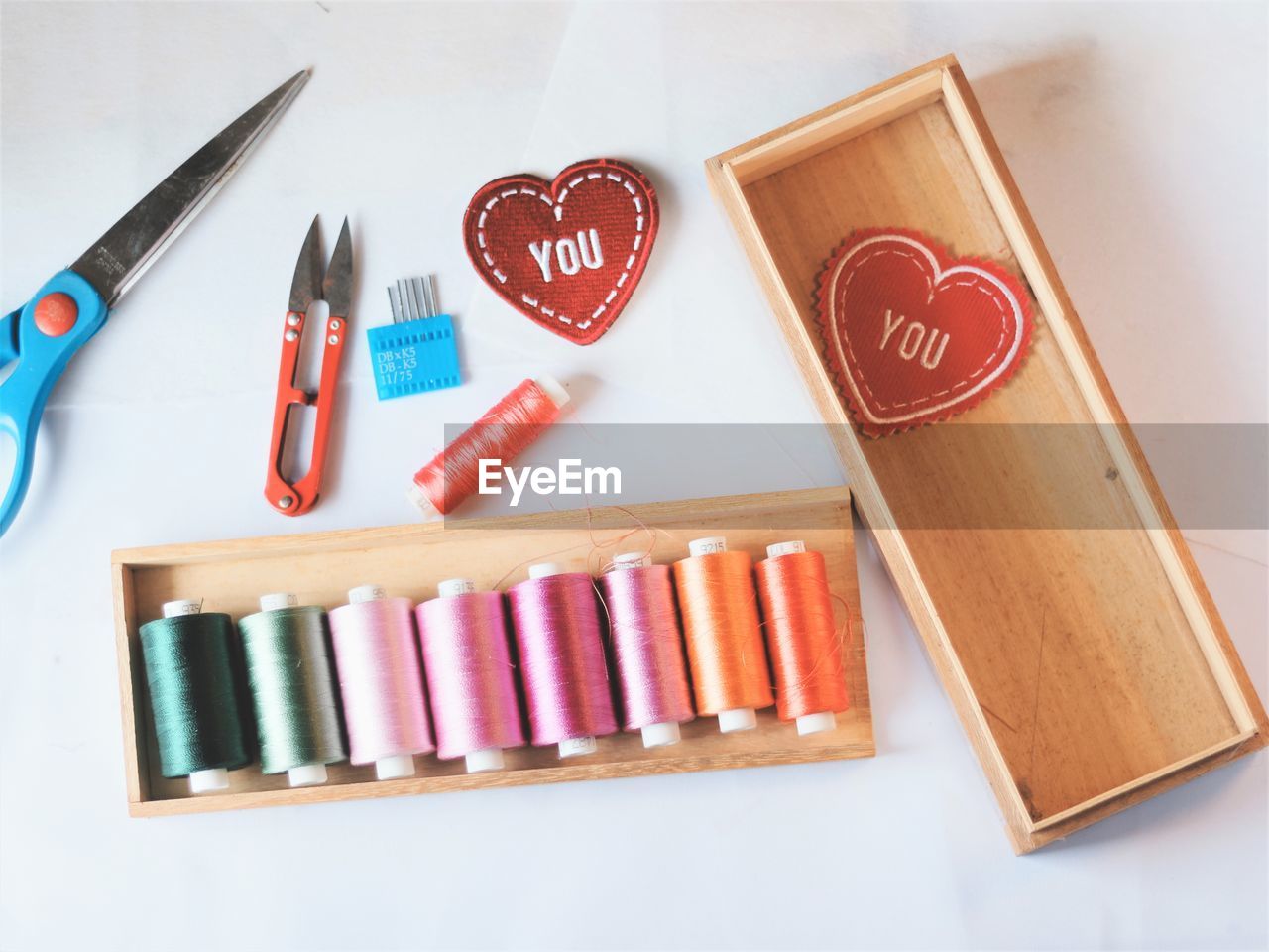 Directly above shot of multi colored sewing items on table