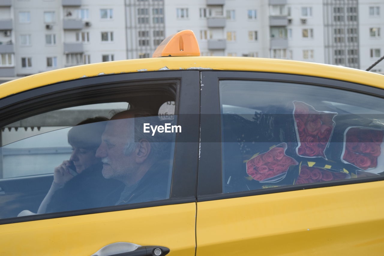 View of city street seen through car window