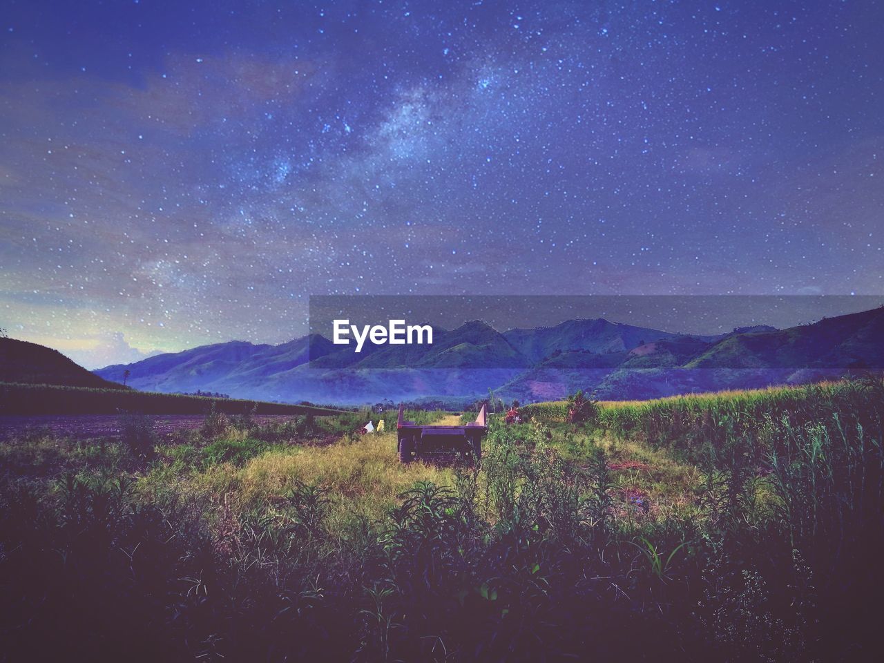 Scenic view of field against sky at night