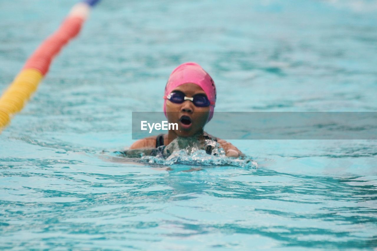 Girl swimming in pool