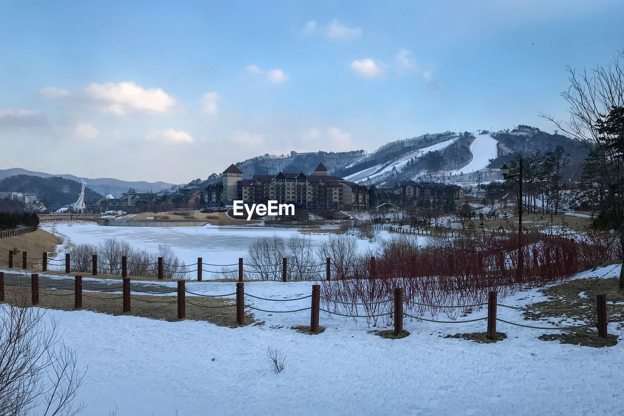 Scenic view of alpensia ski resort against cloudy sky, pyeongchang, south korea