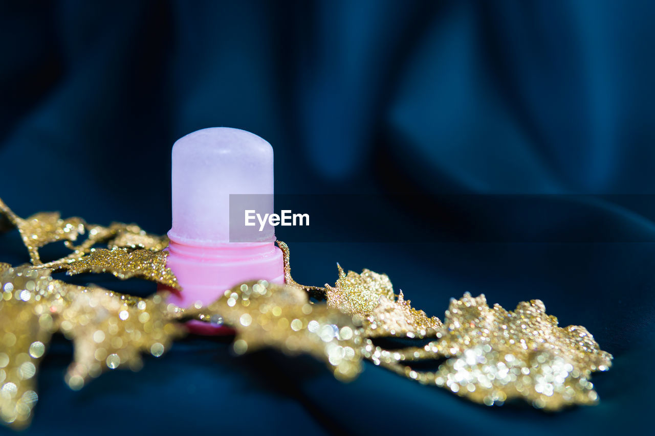 CLOSE-UP OF ICE CREAM ON ILLUMINATED TABLE