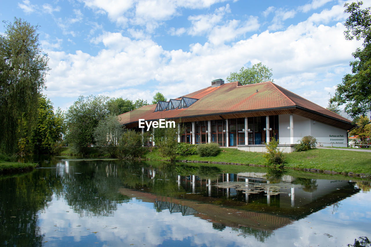 REFLECTION OF BUILDING ON LAKE