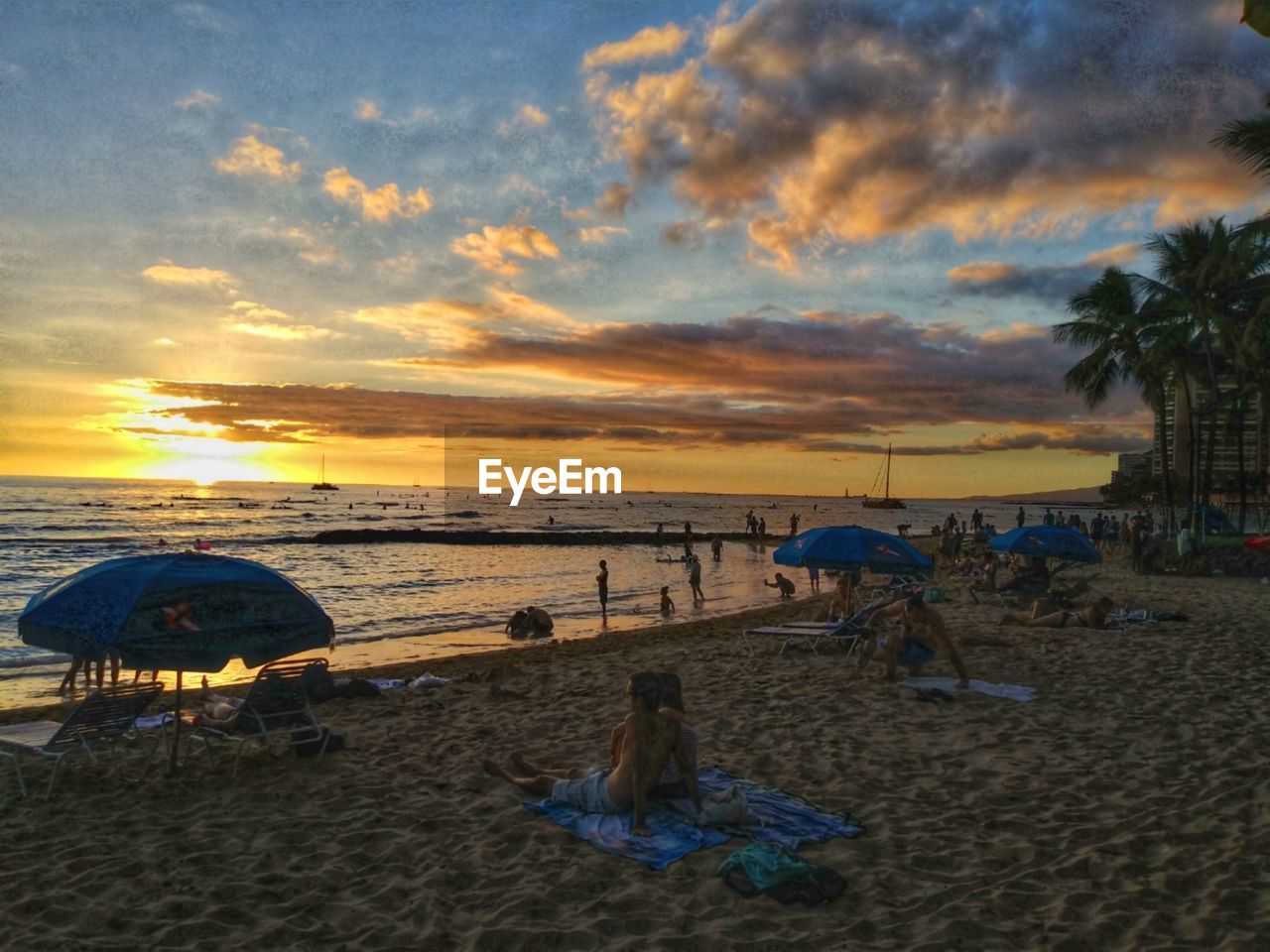 SCENIC VIEW OF BEACH DURING SUNSET