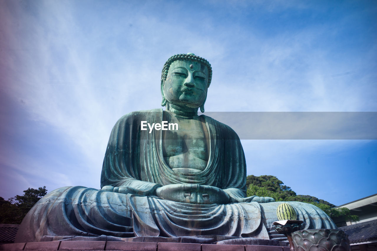 Low angle view of statue of big buddha in kamakura, japan