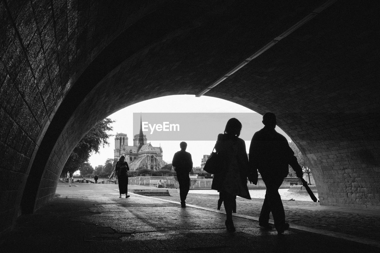 View of silhouette people walking in city