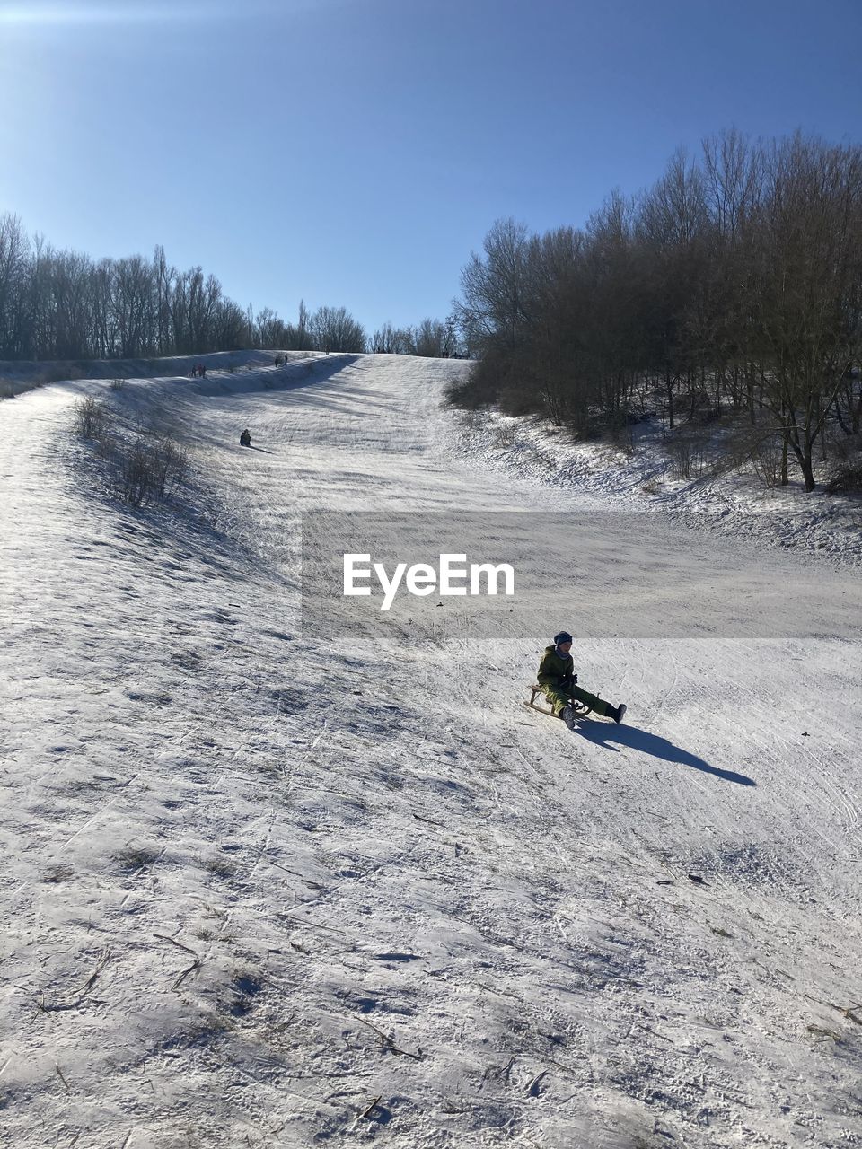 FULL LENGTH OF PERSON ON SNOW FIELD