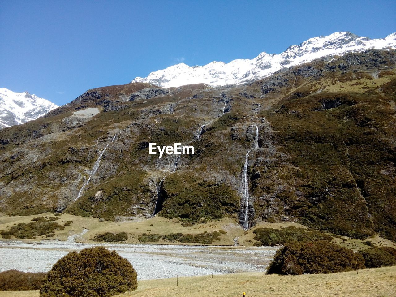 Scenic view of mountains against sky during winter