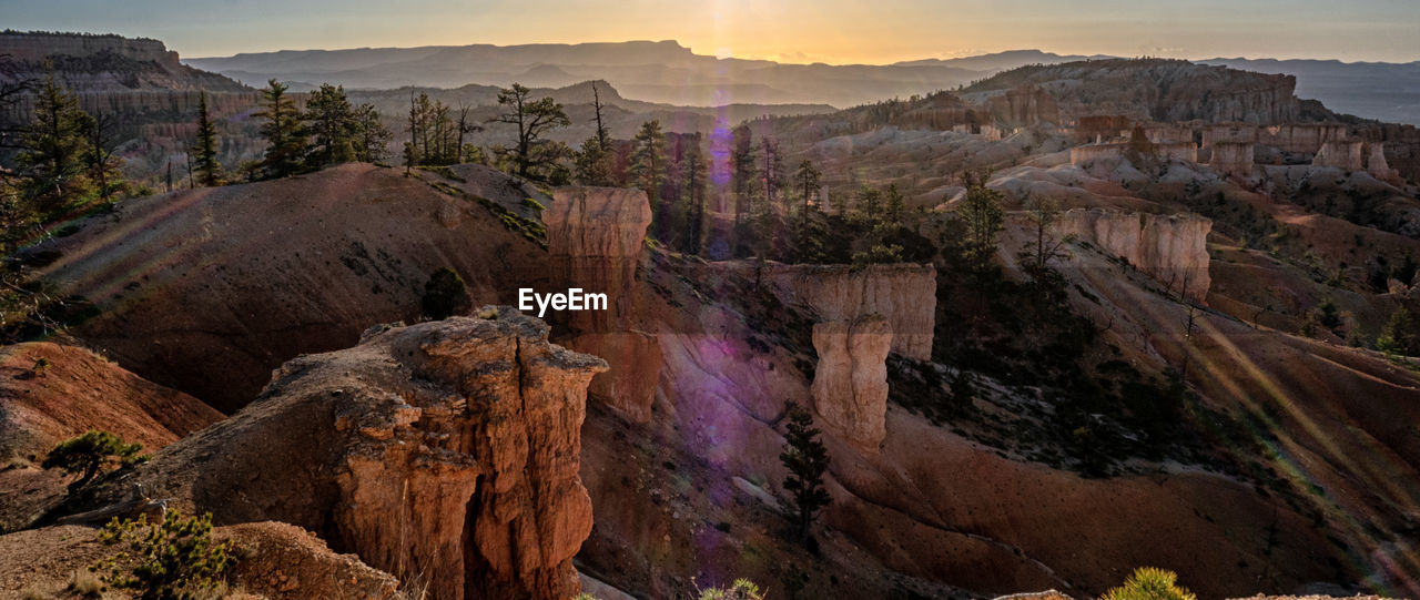 Scenic view of landscape against sky during sunset