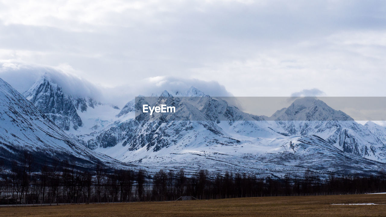 Scenic view of snowcapped mountains against sky