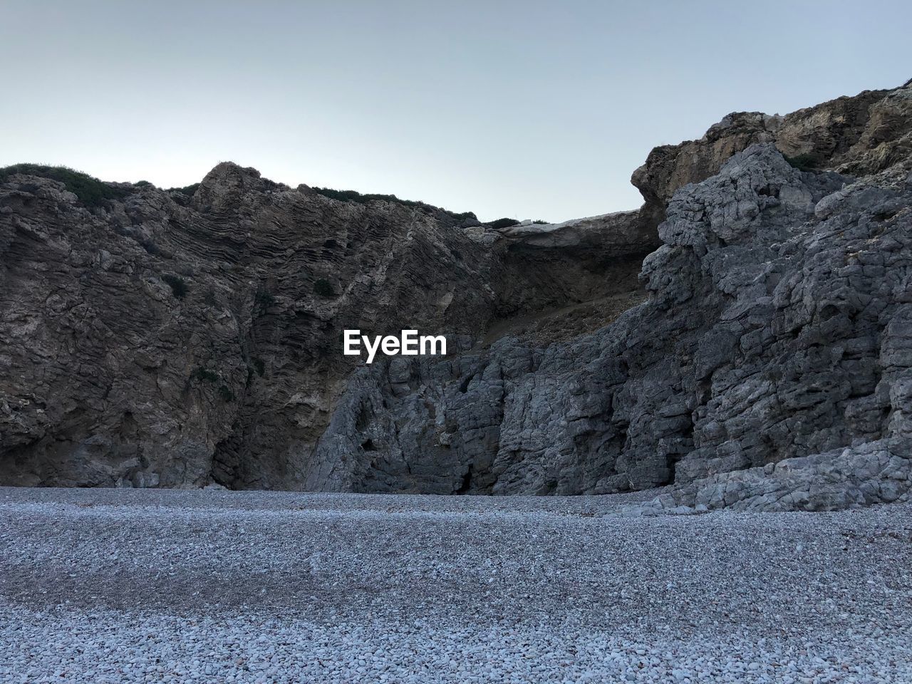 Scenic view of rocky mountains against clear sky