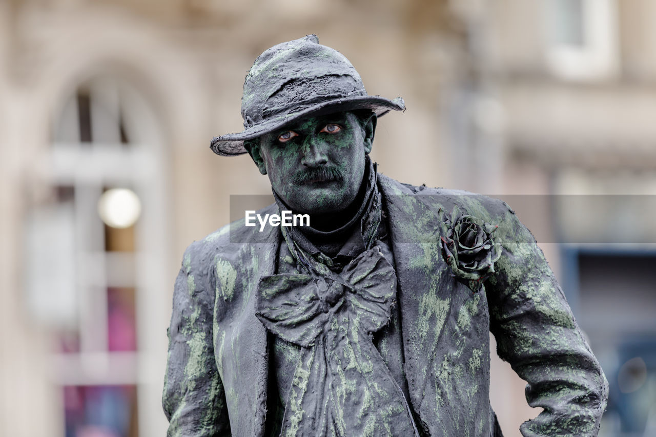 CLOSE-UP OF FEMALE STATUE AGAINST BLURRED MOTION