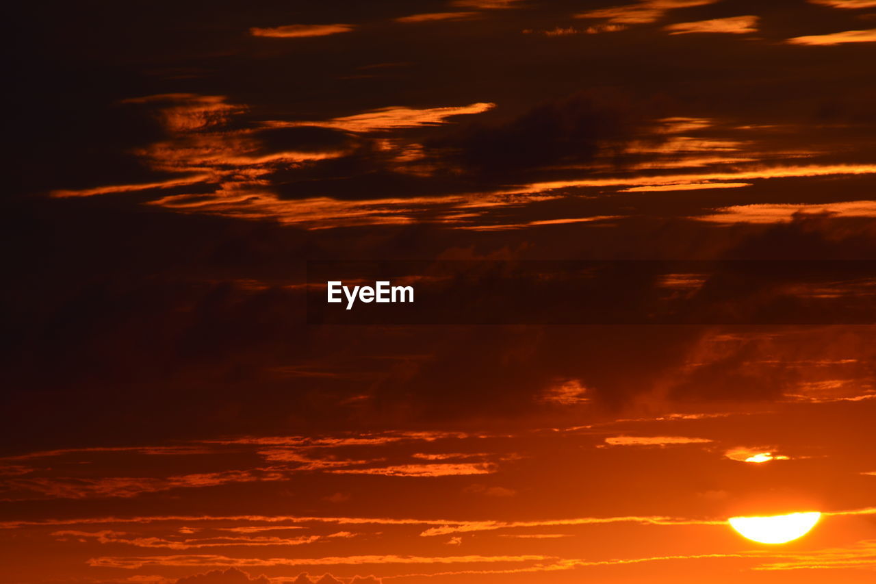 LOW ANGLE VIEW OF CLOUDS DURING SUNSET