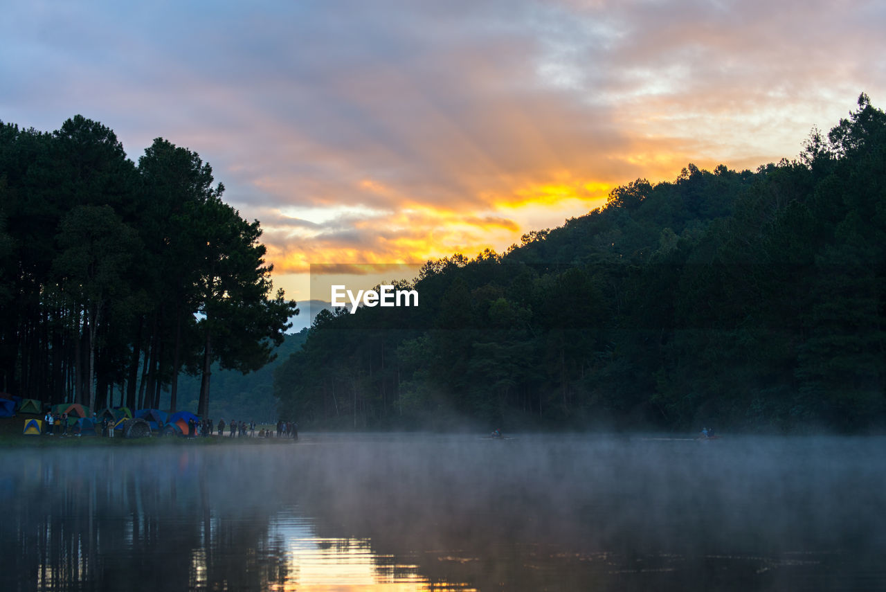 Scenic view of lake against sky during sunset