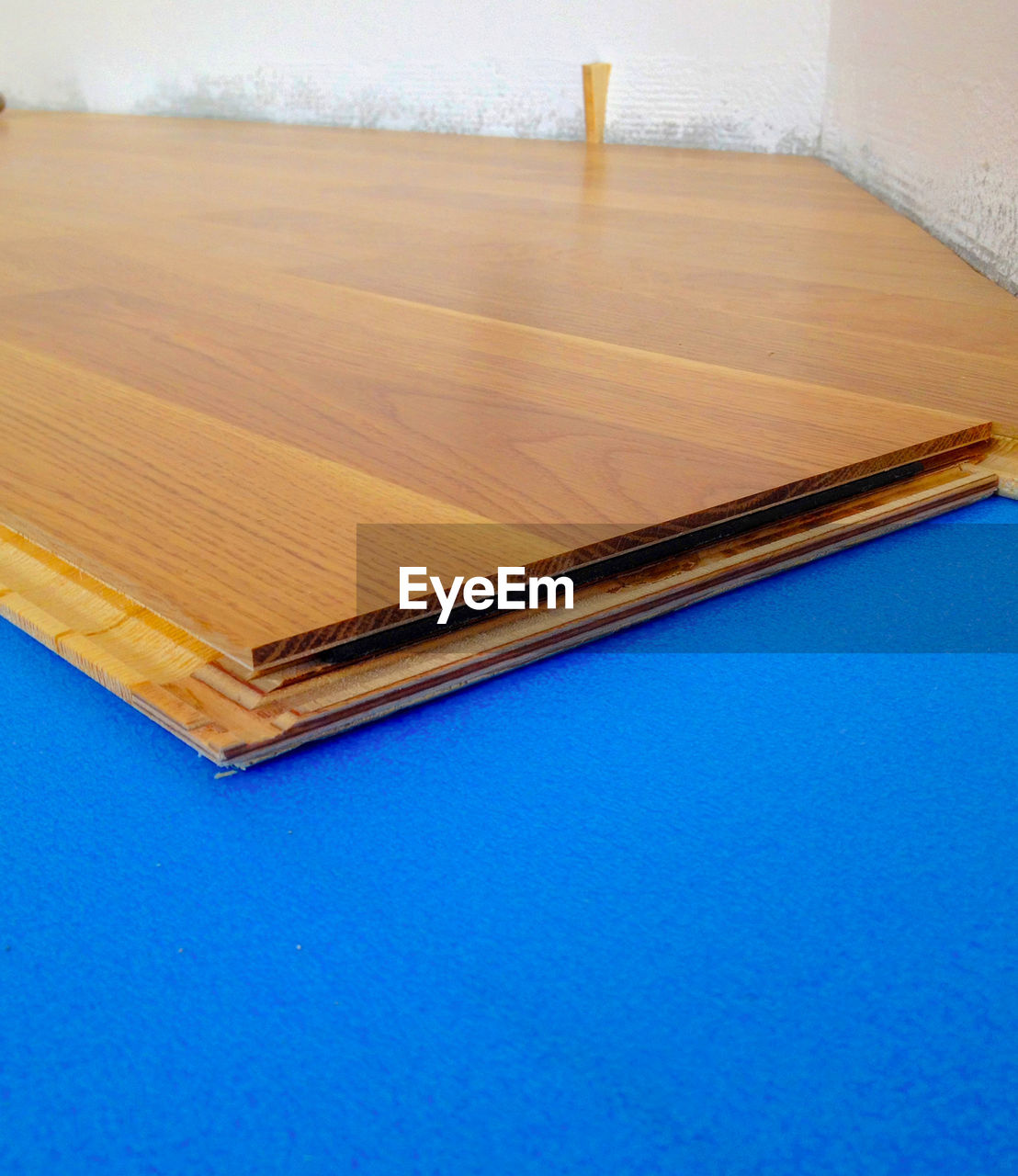 floor, flooring, wood, table, indoors, hardwood, no people, furniture, plywood, copy space, blue, high angle view, laminate flooring, home interior, wood stain