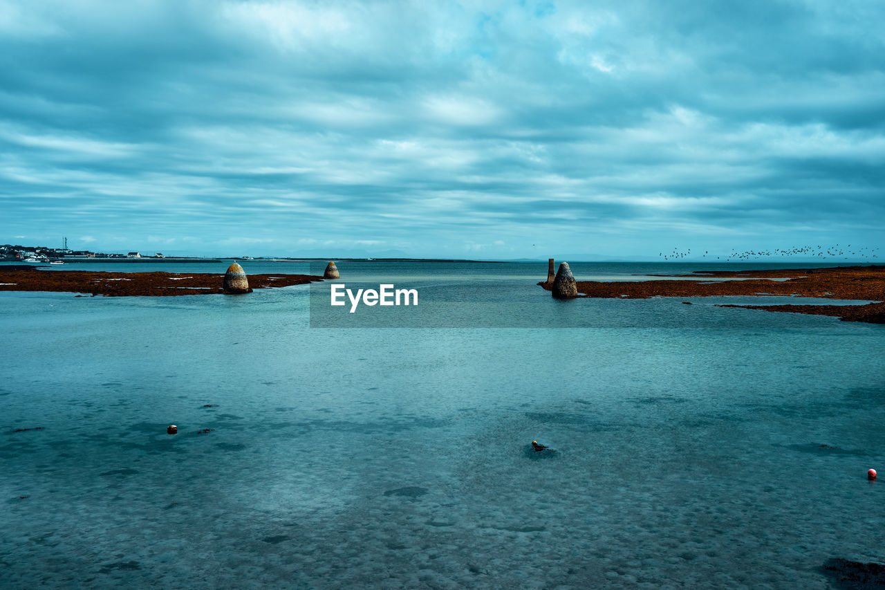 Scenic view of the old harbour of inishmore during low tide