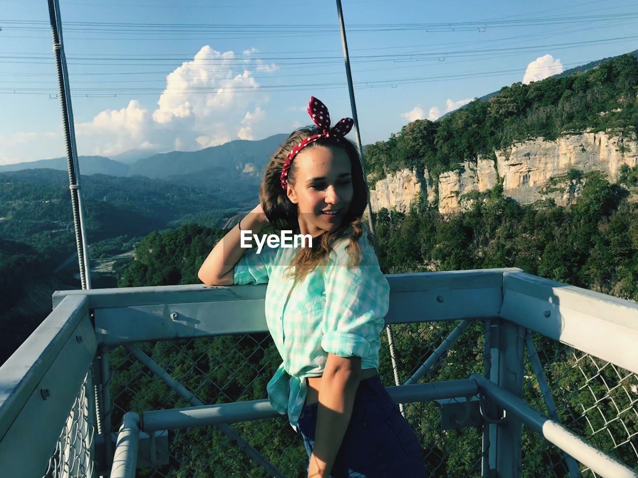 Young woman standing at observation point