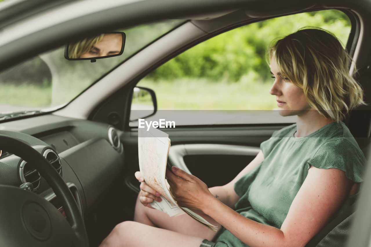 Woman sitting in car