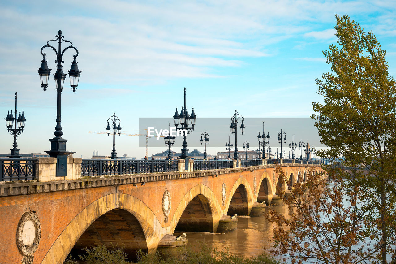 Pont de pierre over garonne river against blue sky