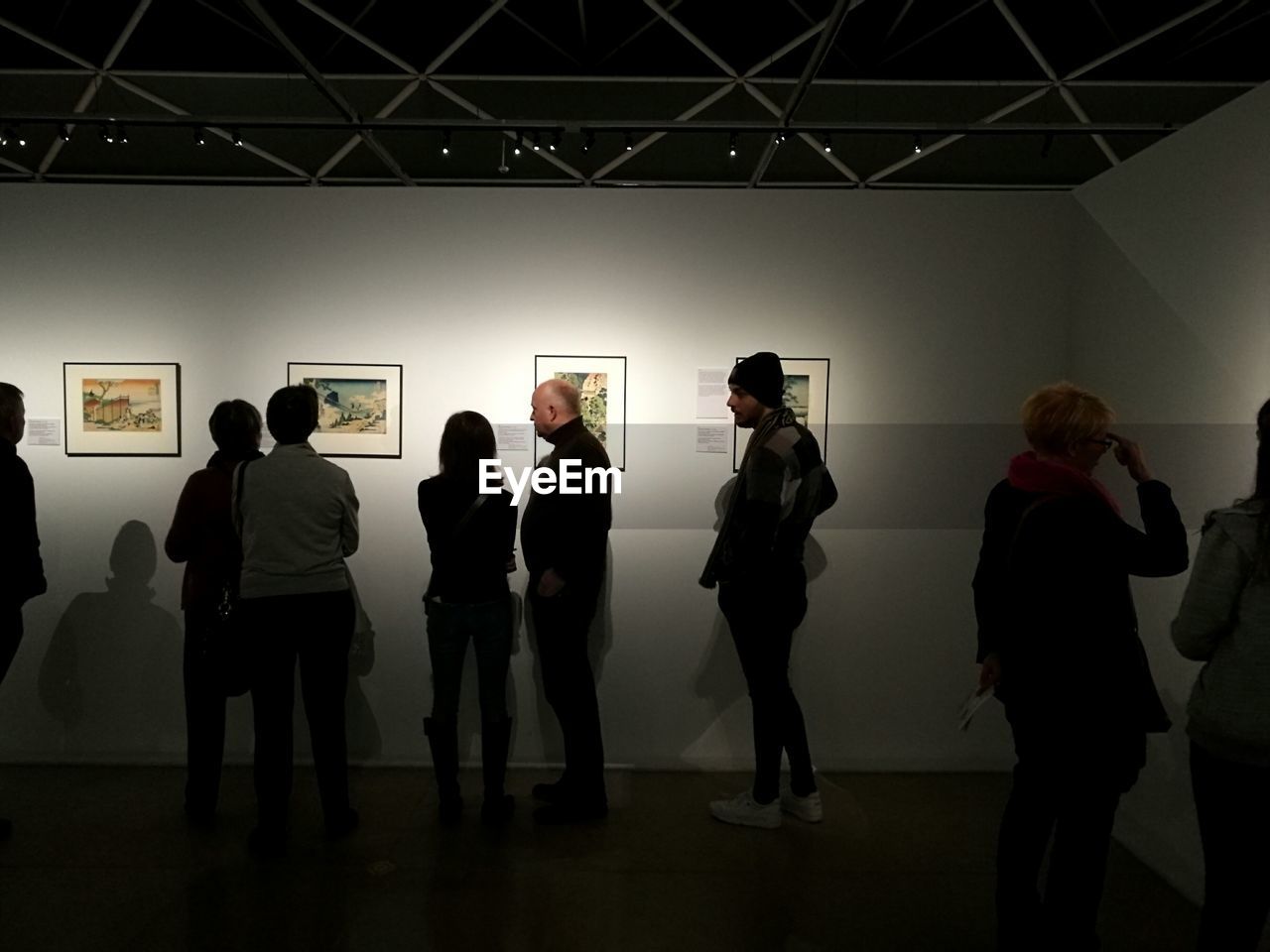 MEN STANDING ON FLOOR