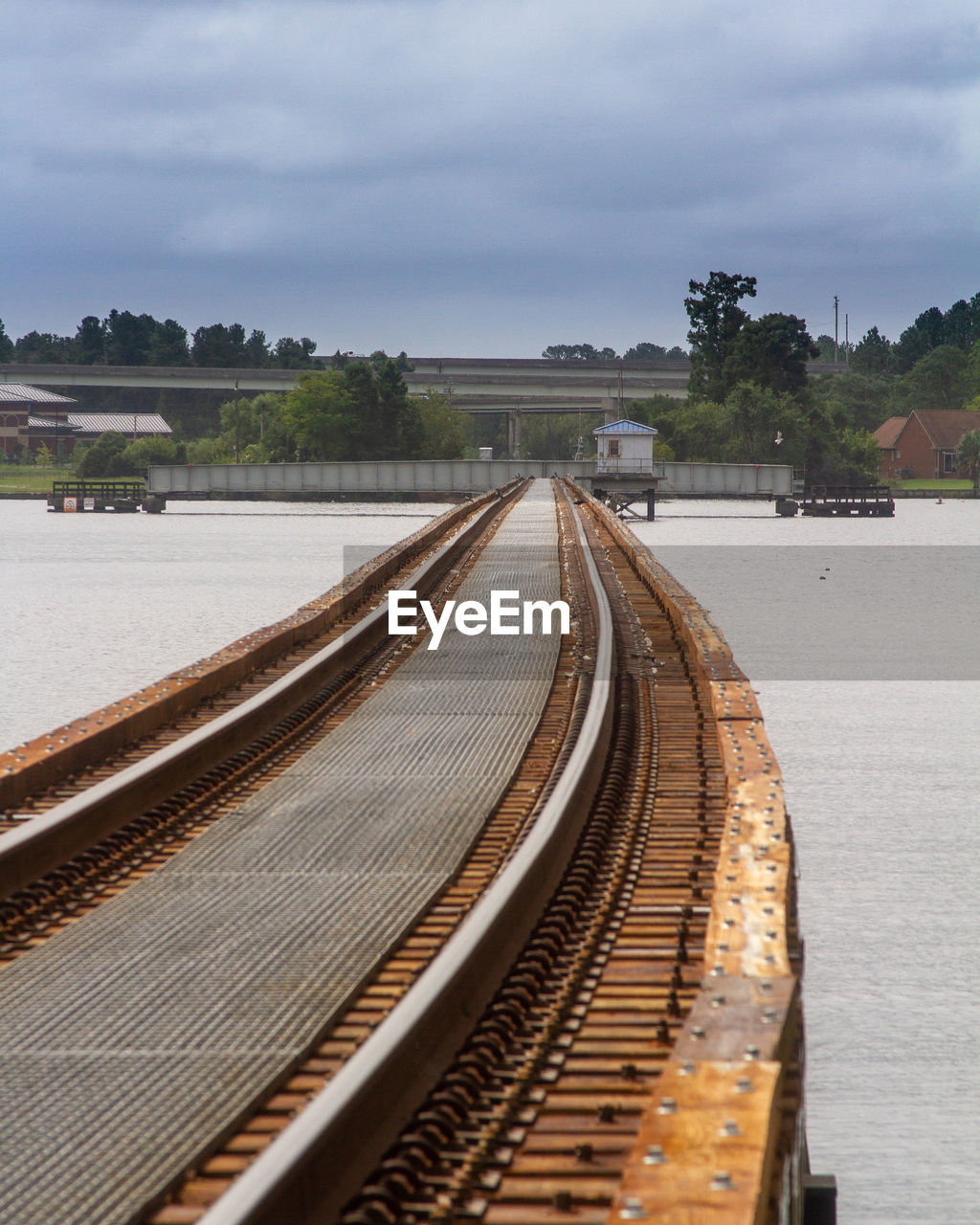 High angle view of railroad tracks across a river 