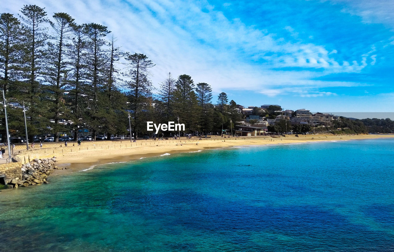 Scenic view of sea against blue sky