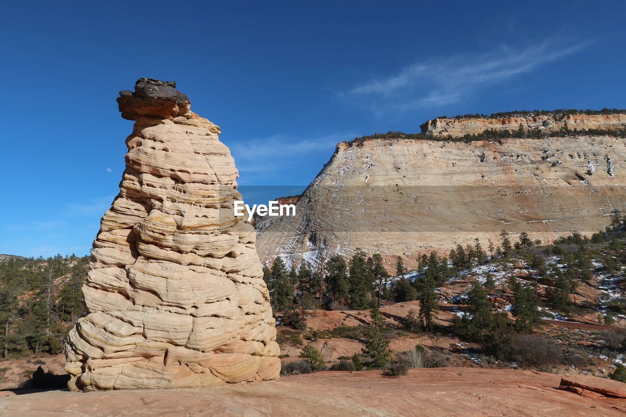White rock formation and hill at checkerboard mesa