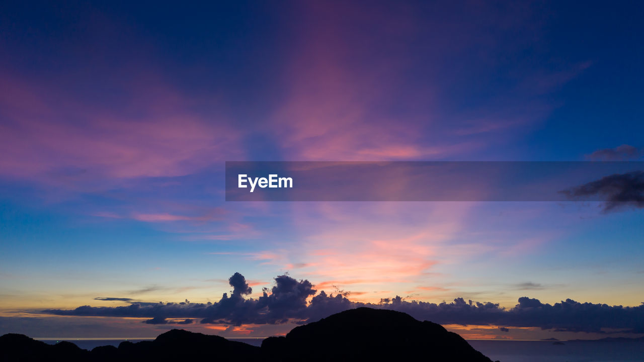 Twilight landscape blue sky and pastel tone romantic time with silhouette mountain phi phi island