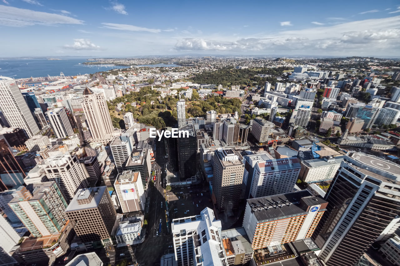 Aerial view of modern buildings in city against sky