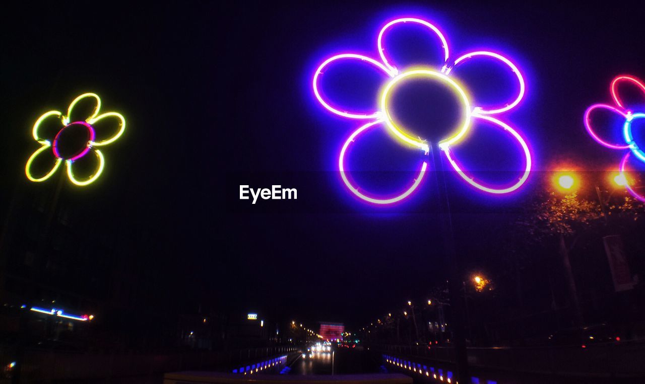 Illuminated decoration in city at night