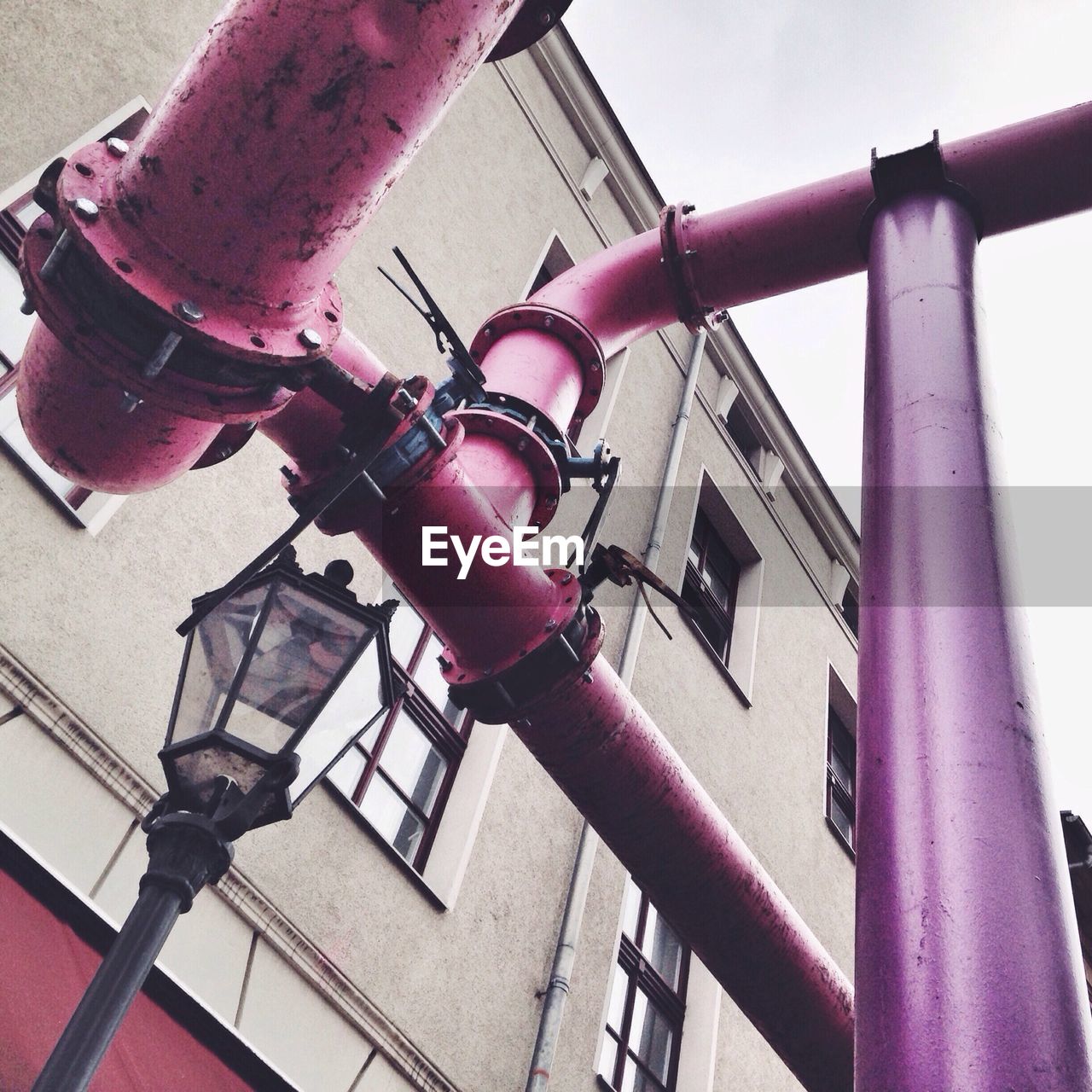 Pink pipes outside a residential building