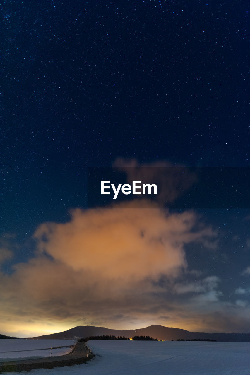 Scenic view of sea against sky at night