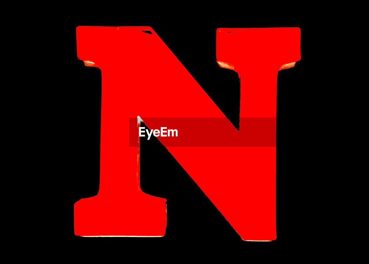 Close-up of letter n against black background