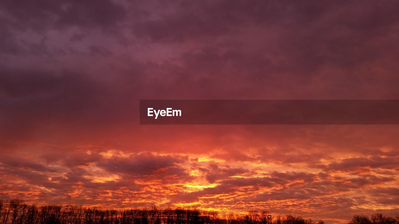 Low angle view of orange cloudy sky during sunset