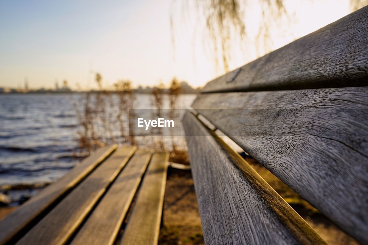 CLOSE-UP OF BOAT ON PIER AGAINST SKY