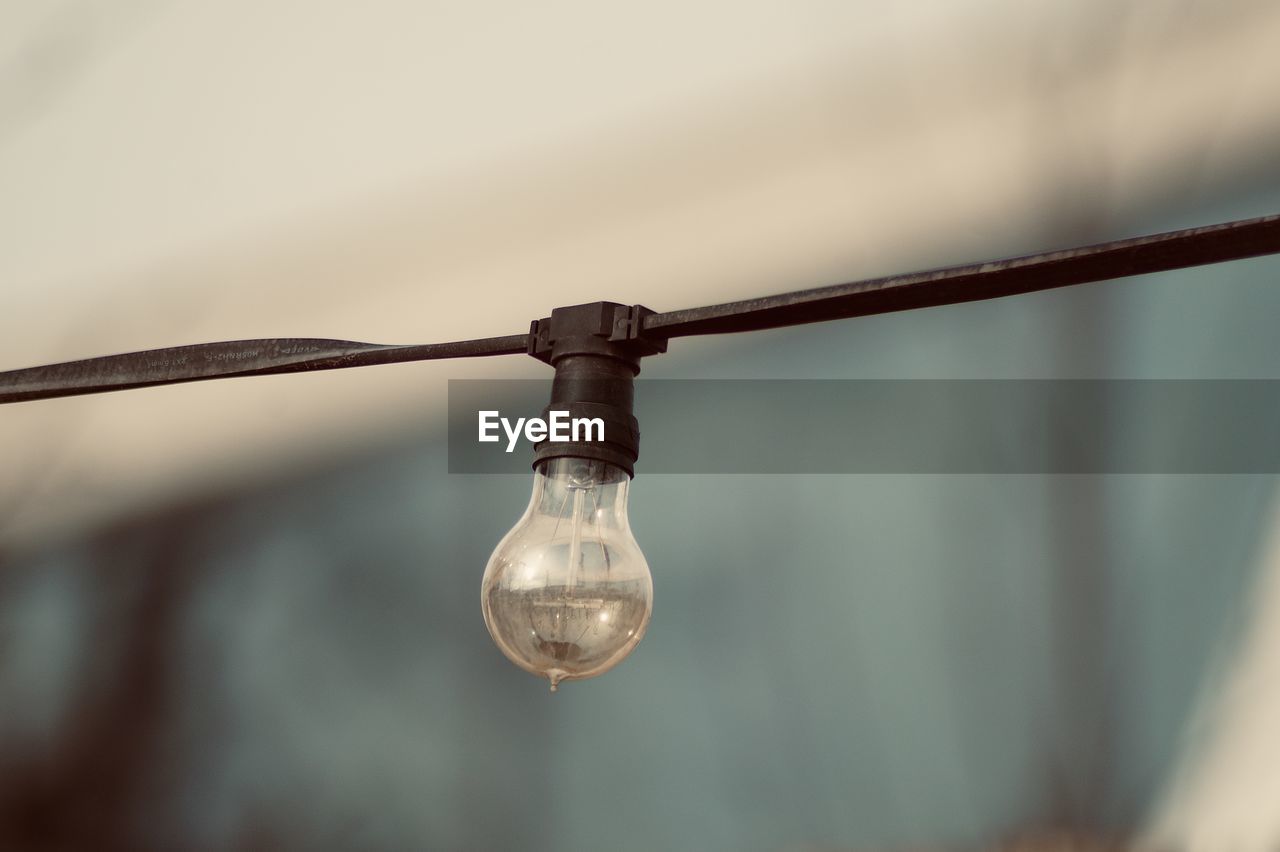 Close-up of light bulb against blurred background