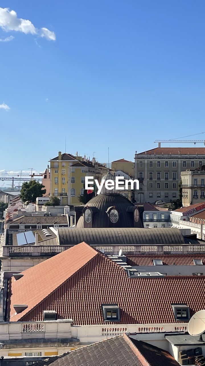 architecture, building exterior, built structure, city, sky, building, roof, urban area, nature, downtown, day, residential district, no people, cityscape, travel destinations, blue, house, sunny, outdoors, travel, clear sky, town, sunlight, street