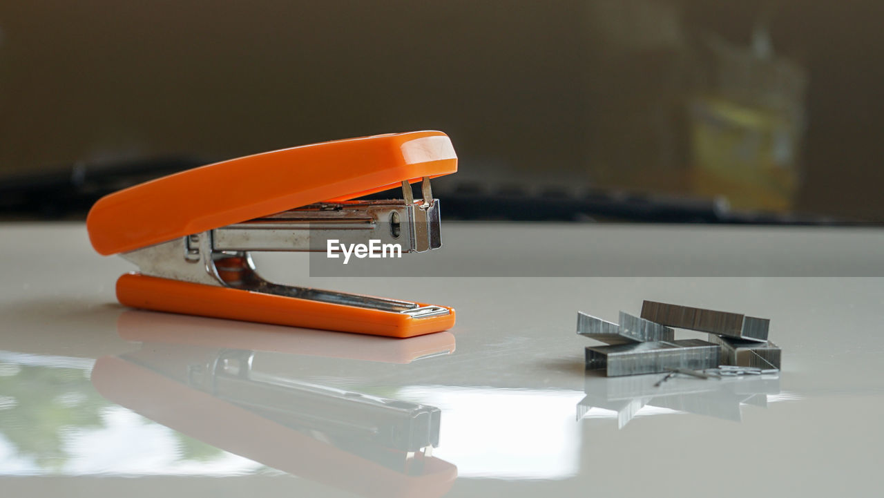 Close up of the stapler on the table