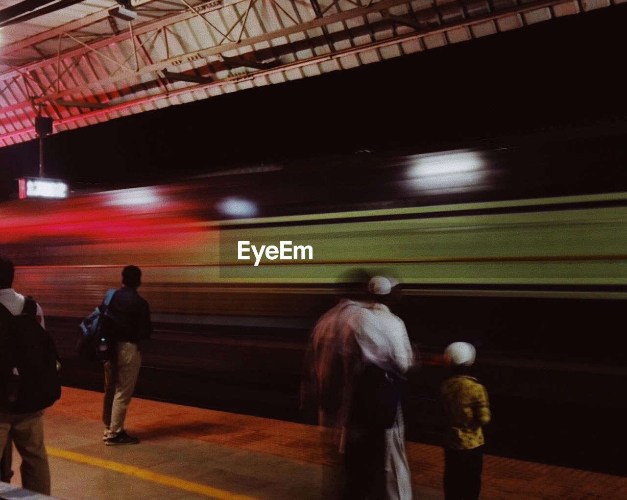 Blurred motion of train at railroad station platform