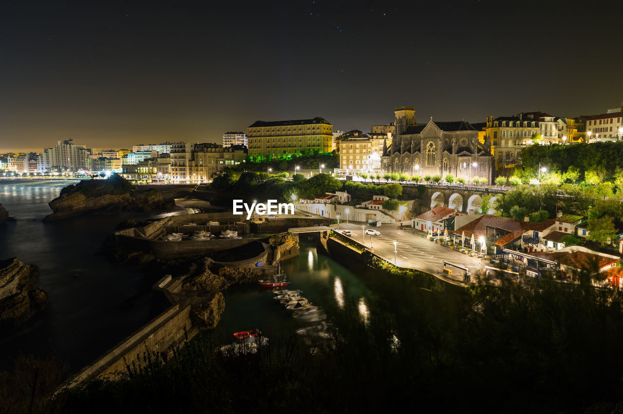 High angle shot of sea with buildings in distance