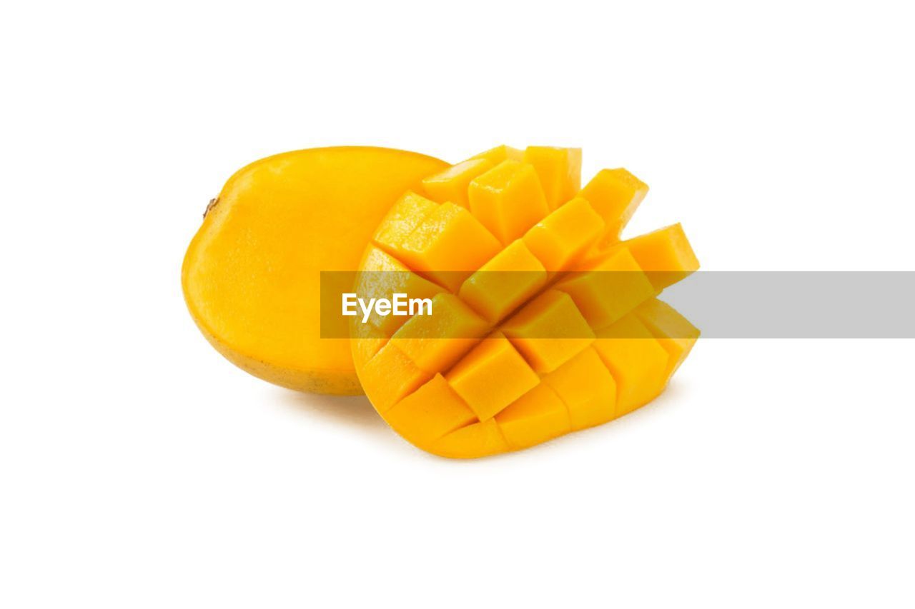CLOSE-UP OF LEMON AGAINST WHITE BACKGROUND
