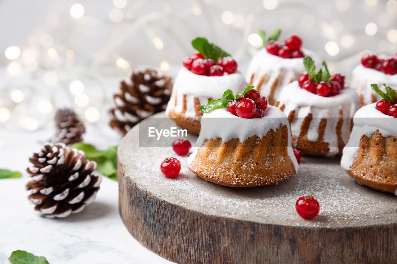 High angle view of christmas muffins with pine cones on table