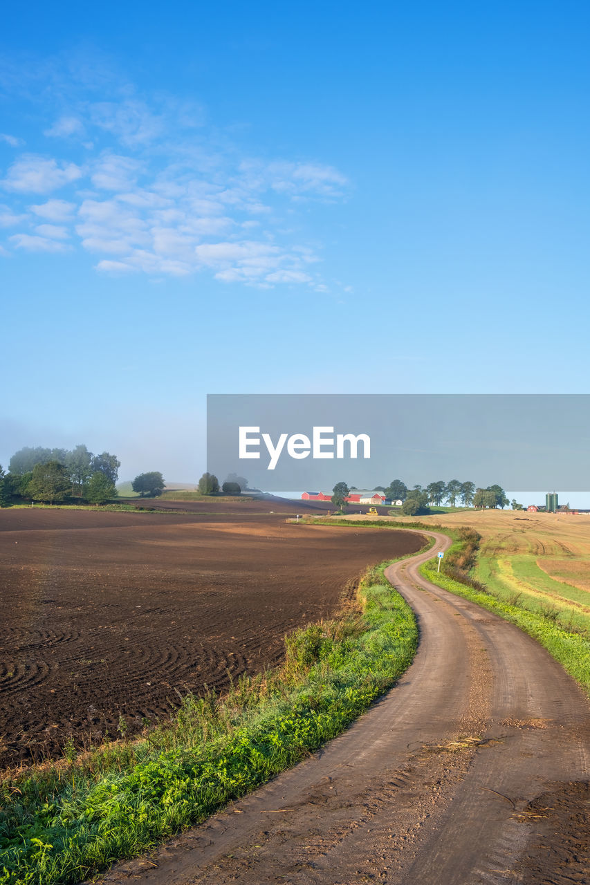 Winding dirt road in a rural landscape