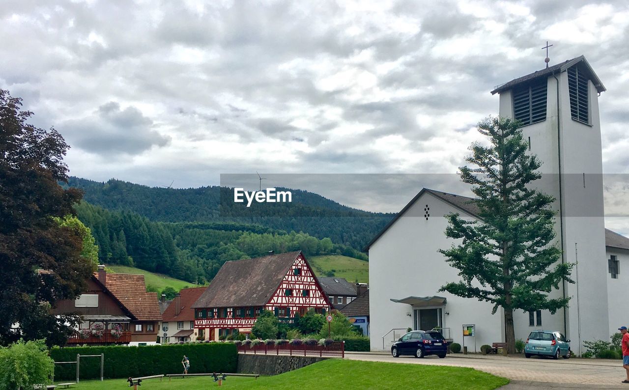 Houses against sky in city