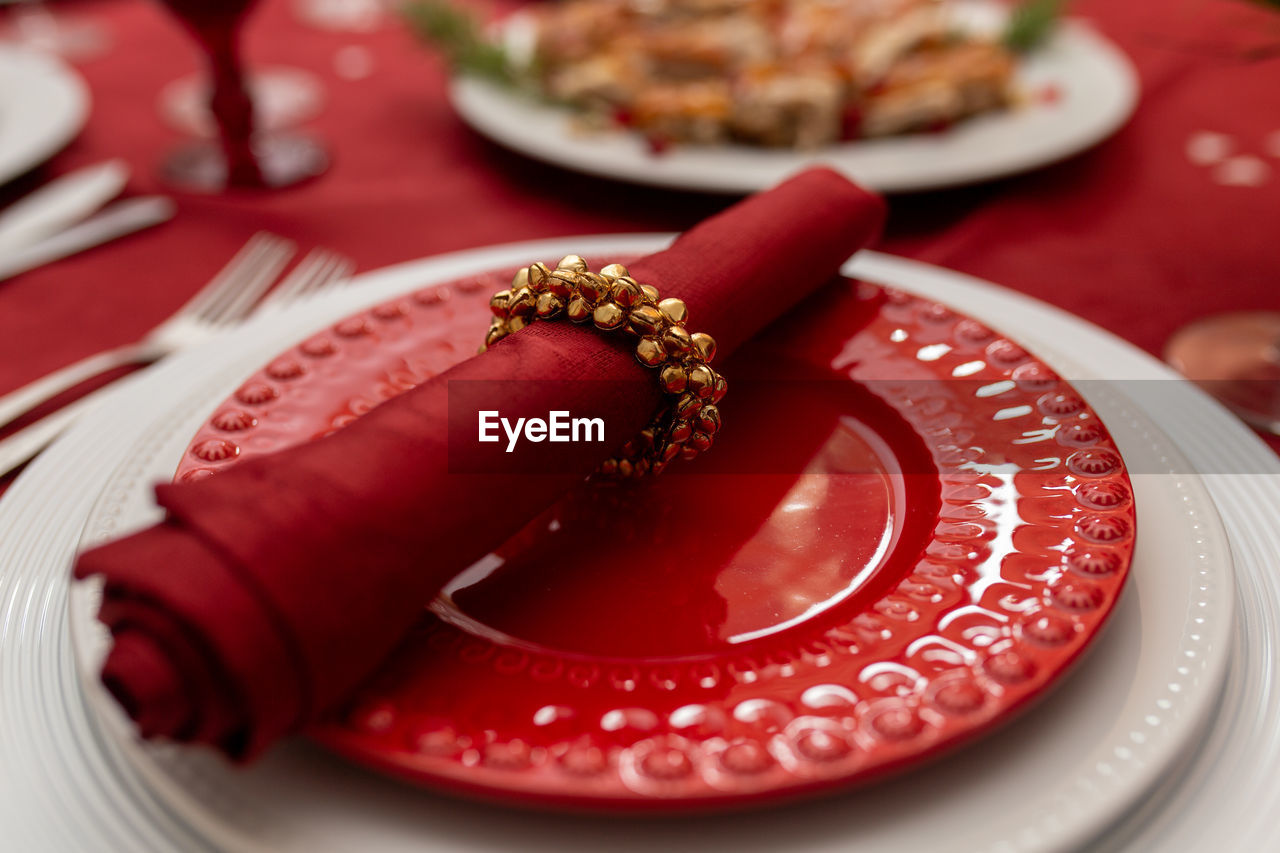 High angle view of red plate on table