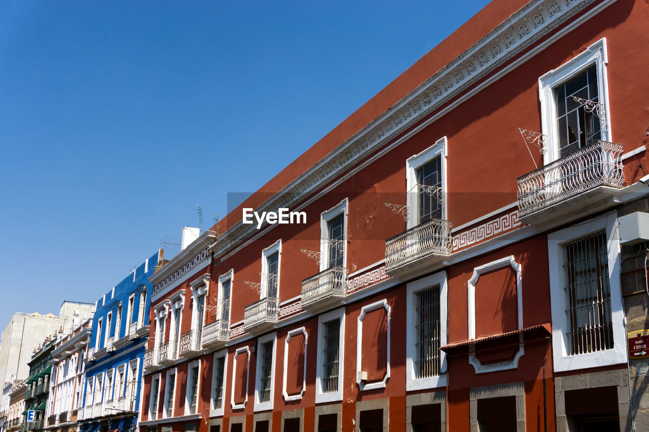 Low angle view of residential building against clear sky