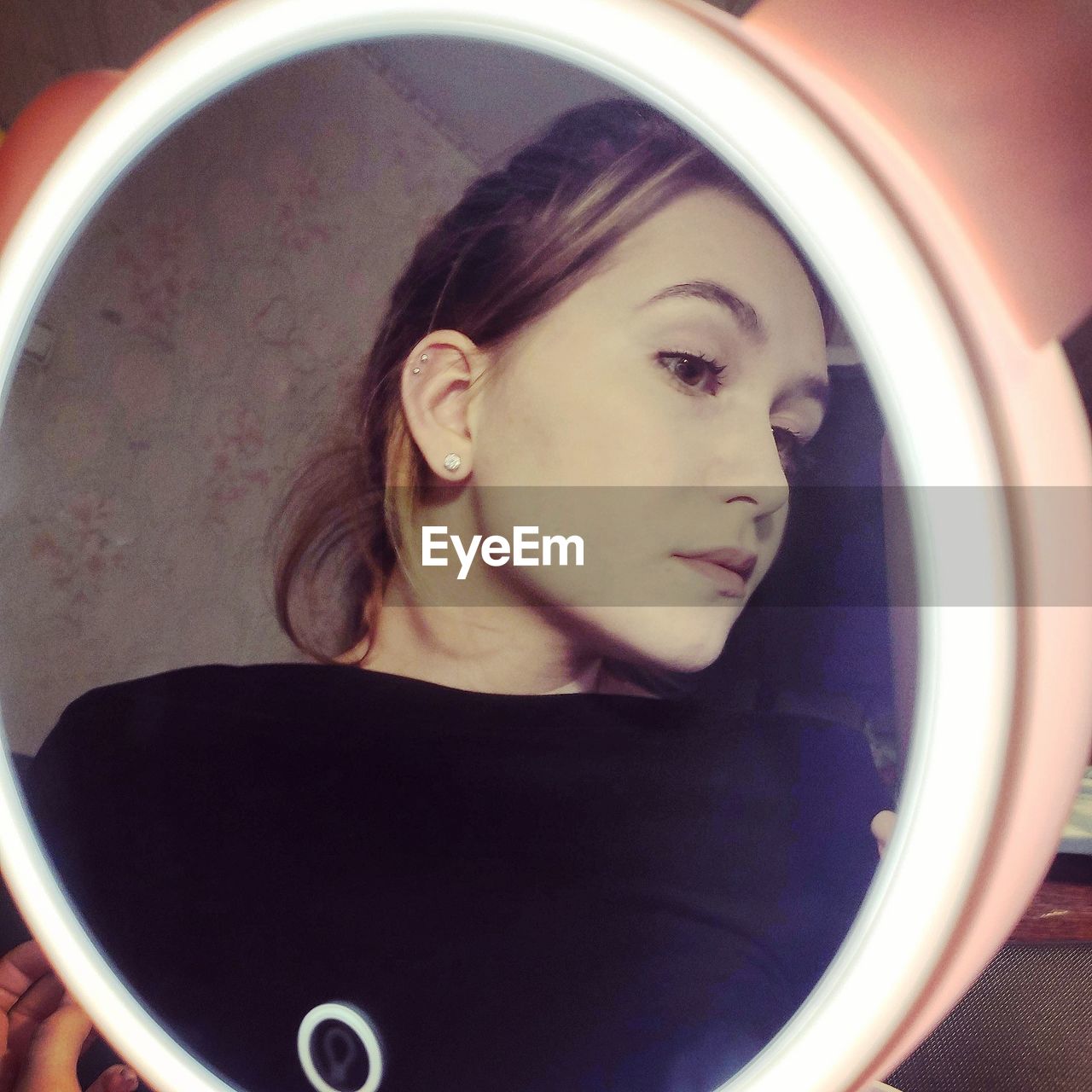 PORTRAIT OF A YOUNG WOMAN WITH REFLECTION