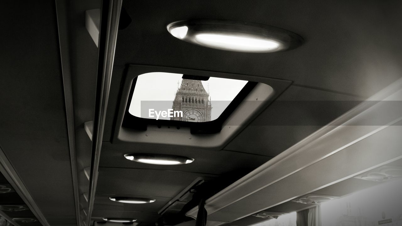 Low angle view of big ben seen from bus sun roof