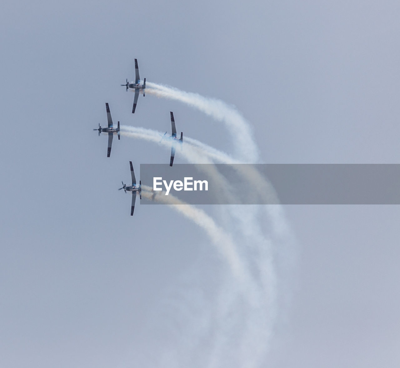 LOW ANGLE VIEW OF HELICOPTER AGAINST SKY